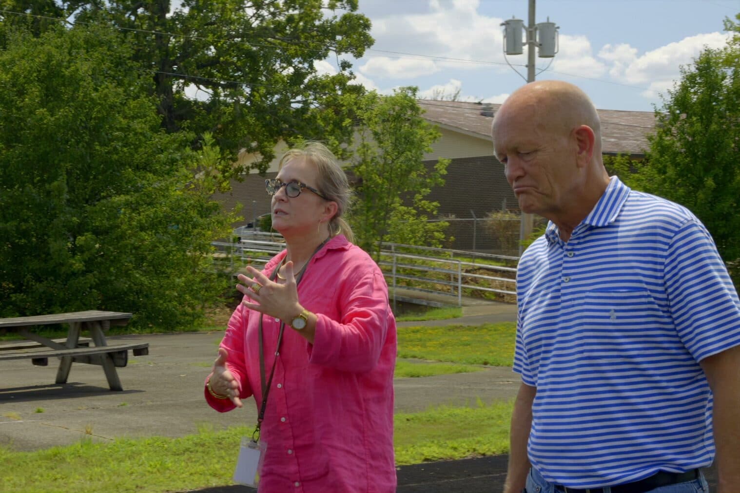 A counselor and client talking outdoors on the Natural State Recovery Centers grounds